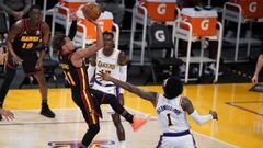 Atlanta Hawks guard Trae Young, left, shoots over Los Angeles Lakers guard Kentavious Caldwell-Pope (1) during the first half of an NBA basketball game Saturday, March 20, 2021, in Los Angeles. (AP Photo/Marcio Jose Sanchez)