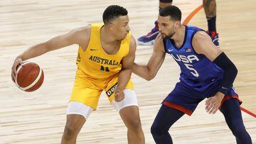 Dante Exum of the Australia Boomers is guarded by Zach LaVine of the United States during an exhibition game at Michelob Ultra Arena ahead of the Tokyo Olympic Games on July 12, 2021 in Las Vegas, Nevada. 