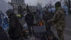People keep warm by fires outside the main rail terminal on March 07, 2022 in Lviv, Ukraine. 