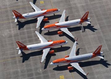 FILE PHOTO: SCHOENEFELD, GERMANY - JUNE 01: Passenger planes of discount airline EasyJet that have been temporarily pulled out of service stand parked at Berlin-Brandenburg Airport during the coronavirus crisis on June 01, 2020 in Schoenefeld, Germany.