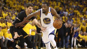 OAKLAND, CA - JUNE 12: Kevin Durant #35 of the Golden State Warriors is defended by Kyle Korver #26 of the Cleveland Cavaliers during the second half in Game 5 of the 2017 NBA Finals at ORACLE Arena on June 12, 2017 in Oakland, California. NOTE TO USER: U