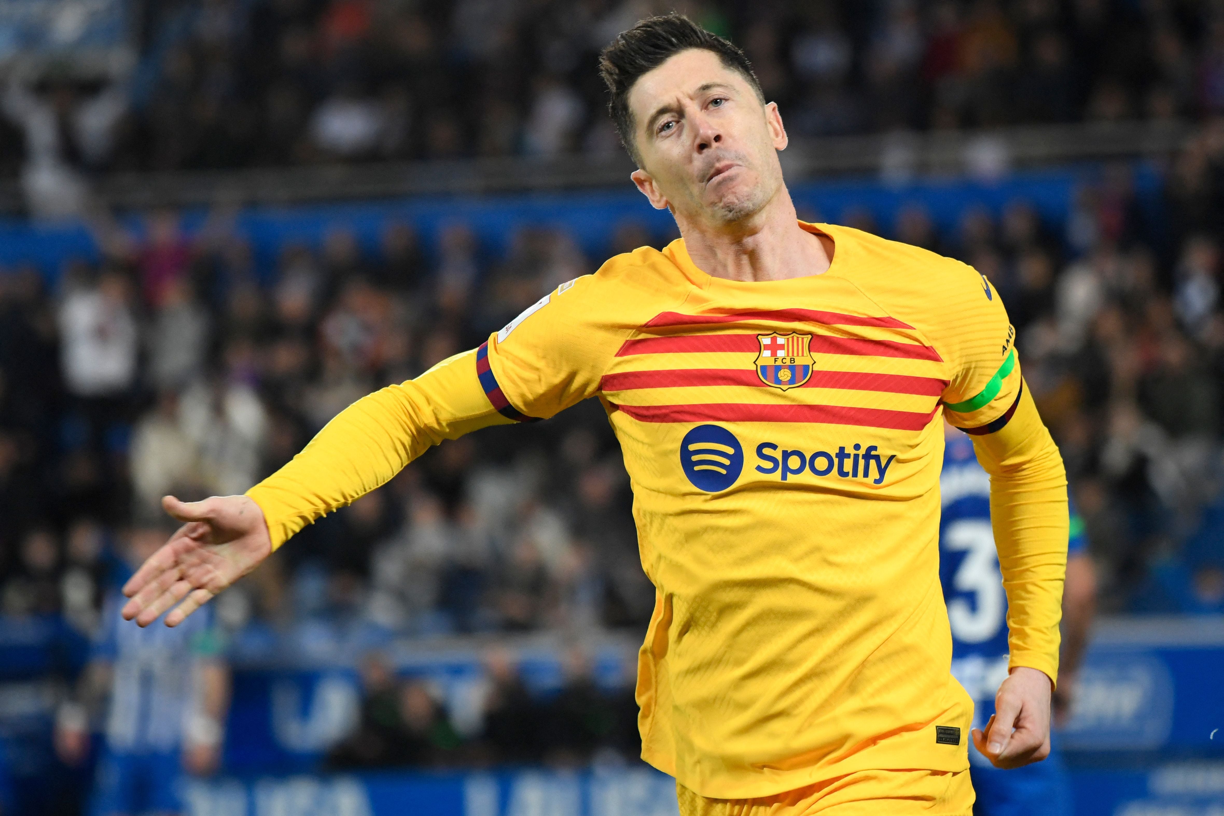 Barcelona's Polish forward #09 Robert Lewandowski celebrates scoring the opening goal during the Spanish league football match between Deportivo Alaves and FC Barcelona at the Mendizorroza stadium in Vitoria on February 3, 2024. (Photo by Ander Gillenea / AFP)