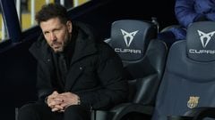 Atletico Madrid's Argentinian coach Diego Simeone sits on the bench during the Spanish league football match between FC Barcelona and Club Atletico de Madrid at the Estadi Olimpic Lluis Companys in Barcelona on December 3, 2023. (Photo by LLUIS GENE / AFP)