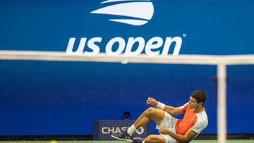 NEW YORK, USA, September 09:   Carlos Alcaraz of Spain collapses to the ground after his five-set victory against Frances Tiafoe of the United States in their Men's Singles Semi-Final match on Arthur Ashe Stadium during the US Open Tennis Championship 2022 at the USTA National Tennis Centre on September 9th 2022 in Flushing, Queens, New York City.  (Photo by Tim Clayton/Corbis via Getty Images)