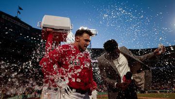 BOSTON, MASSACHUSETTS - APRIL 01: Adam Duvall #18 of the Boston Red Sox is showered in Gatorade after hitting a walk off home run against the Baltimore Orioles at Fenway Park on April 01, 2023 in Boston, Massachusetts.   Nick Grace/Getty Images/AFP (Photo by Nick Grace / GETTY IMAGES NORTH AMERICA / Getty Images via AFP)