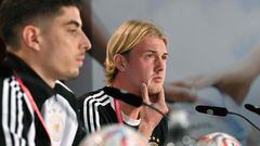 Germany's midfielders Kai Havertz (L) and Julian Brandt attend a press conference at Al Shamal Stadium in Al Shamal, north of Doha, on November 25, 2022, during the Qatar 2022 World Cup football tournament. (Photo by INA FASSBENDER / AFP)