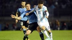 Soccer Football - 2018 World Cup Qualifiers - Uruguay v Argentina - Centenario stadium, Montevideo, Uruguay - August 31, 2017. Argentina&#039;s Lionel Messi and Uruguay&#039;s Cristian Rodriguez in action. REUTERS/Carlos Pazos
