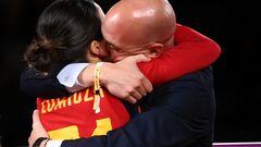 Spain's midfielder Claudia Zornoza #21 is congratuled by President of the Royal Spanish Football Federation Luis Rubiales (R) after winning the Australia and New Zealand 2023 Women's World Cup final football match between Spain and England at Stadium Australia in Sydney on August 20, 2023. The Spanish football federation (RFEF) on August 26, 2023 threatened to take legal action over Women's World Cup player Jenni Hermoso's "lies" about her kiss with its president Luis Rubiales. (Photo by FRANCK FIFE / AFP)