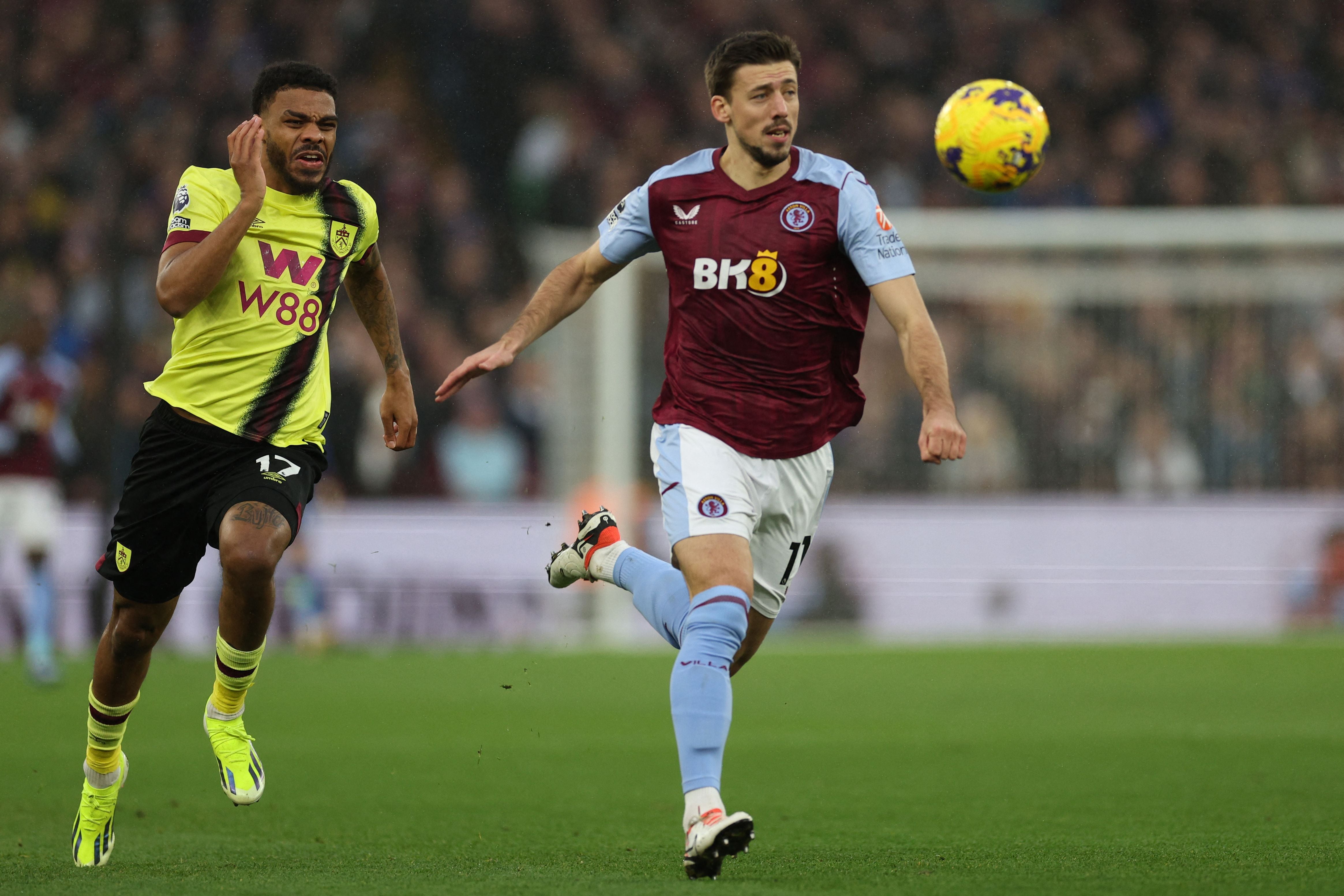 Aston Villa's French defender #17 Clement Lenglet (R) vies with Burnley's South African striker #17 Lyle Foster (L) during the English Premier League football match between Aston Villa and Burnley at Villa Park in Birmingham, central England on December 30, 2023. (Photo by Adrian DENNIS / AFP) / RESTRICTED TO EDITORIAL USE. No use with unauthorized audio, video, data, fixture lists, club/league logos or 'live' services. Online in-match use limited to 120 images. An additional 40 images may be used in extra time. No video emulation. Social media in-match use limited to 120 images. An additional 40 images may be used in extra time. No use in betting publications, games or single club/league/player publications. / 