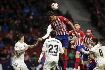 Atlético Madrid's Rodrigo Hernandez leaps highest against Valencia.