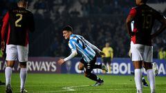Argentina's Racing Tomas Chancalay (C) celebrates after scoring against Peru's Melgar during the Copa Sudamericana group stage football match, at the Presidente Juan Domingo Peron stadium in Avellaneda, Buenos Aires province, Argentina, on May 18, 2022. (Photo by Luis ROBAYO / AFP)