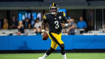 (FILES) In this file photo taken on August 27, 2021, Dwayne Haskins, #3 of the Pittsburgh Steelers, rolls out of the pocket against the Carolina Panthers during the first half of an NFL preseason game at Bank of America Stadium in Charlotte, North Carolina. - Haskins has died at the age of 24, the NFL team confirmed on April 9, 2022, with ESPN reporting he had been struck by a car. (Photo by Chris Keane / GETTY IMAGES NORTH AMERICA / AFP)