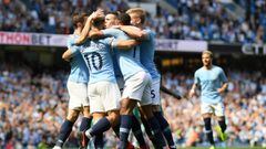 MANCHESTER, ENGLAND - APRIL 20:   Phil Foden of Manchester City celebrates with teammates after scoring his team&#039;s first goal during the Premier League match between Manchester City and Tottenham Hotspur at Etihad Stadium on April 20, 2019 in Manches