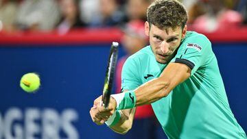 MONTREAL, QUEBEC - AUGUST 11: Pablo Carreno Busta of Spain hits a return against Jannik Sinner of Italy during Day 6 of the National Bank Open at Stade IGA on August 11, 2022 in Montreal, Canada.   Minas Panagiotakis/Getty Images/AFP
== FOR NEWSPAPERS, INTERNET, TELCOS & TELEVISION USE ONLY ==