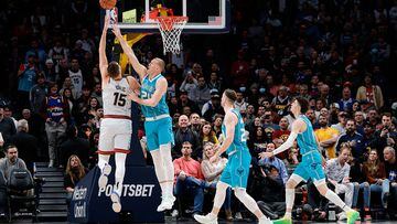 Dec 18, 2022; Denver, Colorado, USA; Denver Nuggets center Nikola Jokic (15) drives to the net against Charlotte Hornets center Mason Plumlee (24) as forward Gordon Hayward (20) and guard LaMelo Ball (1) defend in the first quarter at Ball Arena. Mandatory Credit: Isaiah J. Downing-USA TODAY Sports