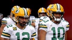 LANDOVER, MARYLAND - OCTOBER 23: Aaron Rodgers #12 of the Green Bay Packers and Jordan Love #10 take the field for warmups before the game against the Washington Commanders at FedExField on October 23, 2022 in Landover, Maryland.   Scott Taetsch/Getty Images/AFP