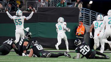 EAST RUTHERFORD, NEW JERSEY - NOVEMBER 24: Jevon Holland #8 of the Miami Dolphins scores a 99 yard touchdown off of an interception thrown by Tim Boyle #7 of the New York Jets during the second quarter in the game at MetLife Stadium on November 24, 2023 in East Rutherford, New Jersey.   Mike Stobe/Getty Images/AFP (Photo by Mike Stobe / GETTY IMAGES NORTH AMERICA / Getty Images via AFP)