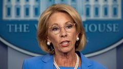 Why has Betsy DeVos submitted her resignation?