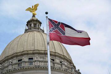 The Mississippi state flag is flown at the state Capitol before being lowered and decommissioned, a day after a bill was signed into law that would replace the state flag that includes a Confederate emblem, in Jackson, Mississippi, U.S., July 1, 2020. REU