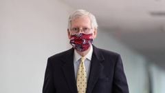 Senate Majority Leader Mitch McConnell (R-KY), wearing a mask, walks to a closed-door luncheon with fellow Republicans, on Capitol Hill in Washington, U.S. July 21, 2020. REUTERS/Tom Brenner