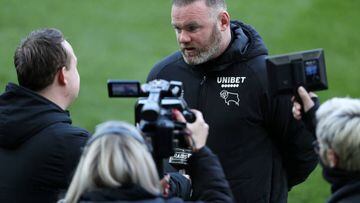 SWANSEA, WALES - APRIL 09: Wayne Rooney, Manager of Derby County speaks to the media after their sides defeat during the Sky Bet Championship match between Swansea City and Derby County at Swansea.com Stadium on April 09, 2022 in Swansea, Wales. (Photo by Ryan Hiscott/Getty Images)