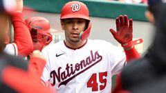 WASHINGTON, DC - OCTOBER 01: Joey Meneses #45 of the Washington Nationals celebrates scoring a run on a Luis Garcia #2 single in the seventh inning during game one of a doubleheader baseball game against the Philadelphia Phillies at Nationals Park on October 1, 2022 in Washington, DC.   Mitchell Layton/Getty Images/AFP