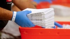 A worker sorts ballots at the Sacramento Registrar of Voters as California goes to the polls in a gubernatorial recall election allowing the voting public to remove current governor Gavin Newsom and replace him with one of 46 candidates, in Sacramento, Ca